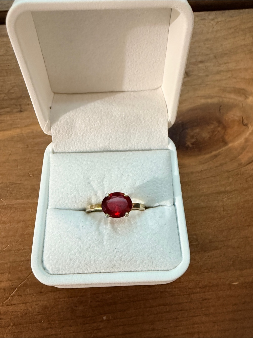 Gold tone Ring with Oval Red Gemstone